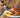 Golden roasted chicken glazed with maple balsamic and garnished with rosemary and orange slices