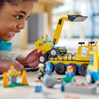 A child playing with a LEGOS construction set.