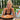 Woman enjoying a slice of pizza outdoors with a salad and a bag of Neopolitan Style Pizza Dough Mix beside her.