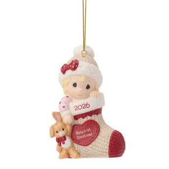Precious Moments 2026 Baby Girl Baby's First Christmas porcelain ornament with baby in stocking and teddy bear keepsake.