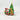 Christmas-themed figurine with Mickey and Minnie Mouse on a train near a decorated tree.