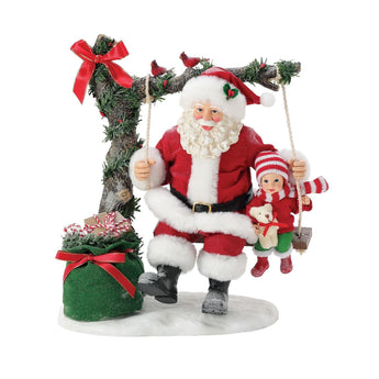 Possible Dreams Santa "Oh What Fun!" figurine featuring Santa and child on a snowy swing with gifts and cardinals, handcrafted holiday decoration.