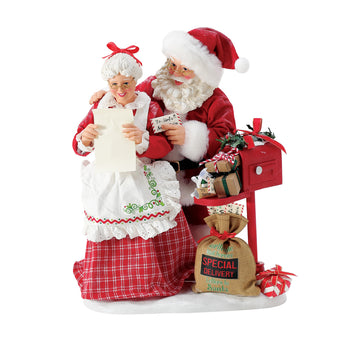 Possible Dreams More Letters for the Clauses figurine featuring Santa and Mrs. Claus reading Christmas letters beside an overflowing North Pole mailbox and special delivery sack.