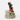 Animated character figurine on a decorative base with floral patterns