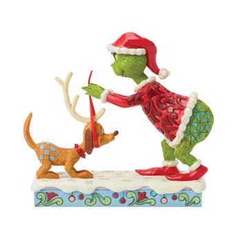 Jim Shore Grinch tying antlers on Max figurine