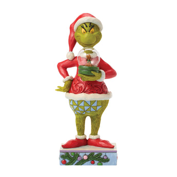 Jim Shore Grinch holding snow globe figurine