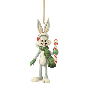 Jim Shore Heartwood Creek Bugs Bunny ornament wearing a Santa hat, scarf, and mittens while holding a candy cane, featuring hand-painted folk-art details and holiday charm.