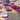Dining table set for a meal with various dishes and drinks, text overlay about party planner services.