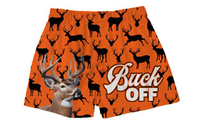 Bright orange boxer shorts with an all-over deer pattern, including a depiction of a deer's head and antlers. The text 'BUCK OFF' is prominently displayed.