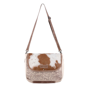 Small Crossbody bag with floral-etched canvas front and genuine cowhide hairon leather flap, adjustable strap, and rustic hardware.