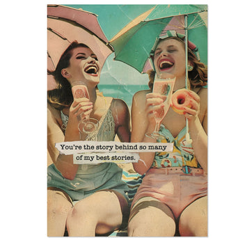 Heartfelt friendship greeting card with retro beach scene featuring two women laughing under umbrellas with drinks and donut, glitter accents, 5x7