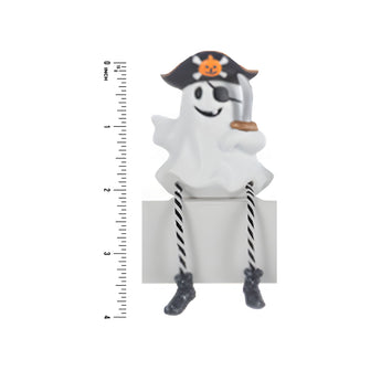 Pirate-themed ghost figurine with a sword, sitting on a white background with a ruler for scale.