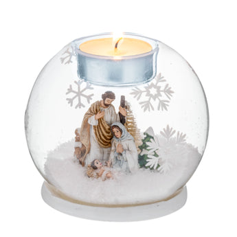 Glass Montages Nativity Tealight Holder with Joseph, Mary, and Baby Jesus surrounded by snow and snowflakes.
