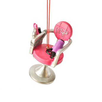 Pink and silver salon chair ornament with hair tools and "I Style" on the backrest, perfect for hairstylists or salon-themed holiday decor.