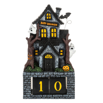 Haunted house Halloween countdown calendar with ghosts, pumpkins, bats, and interchangeable numbered blocks.