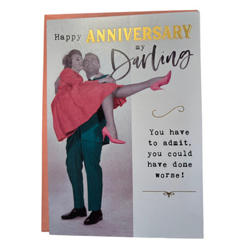 Card with illustration of a man lifting a woman, text 'Happy Anniversary my Darling' and 'You have to admit, you could have done worse!'.