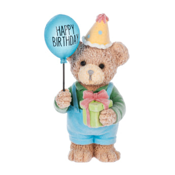 Happy Birthday teddy bear figurine with flocked fur holding blue birthday balloon and gift box.