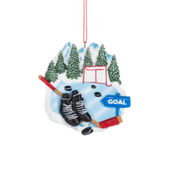 Hocky ornament featuring skates, puck, and goal net with snowy trees and "Goal" sign