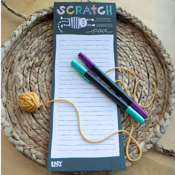 Magnetic cat design notepad on a fridge, featuring 50 easy-to-tear sheets, size 11” x 4.25” with cardboard backing