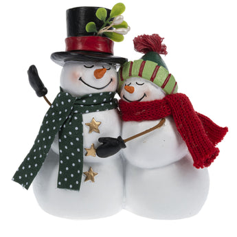 A snowman couple hugging under the mistletoe figurine