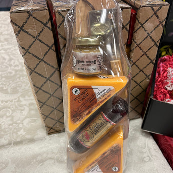 Mille Lacs Meat & Cheese Paddle Board Gift Set with Sausage, cheese, mustard, and cleaver.