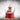 Snow globe with Santa Claus holding a sleigh and reindeer on musical red base.