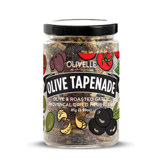 Jar of Olive Tapenade dried herb blend with dried olives, tomatoes, garlic, and herbs on a plain white background.
