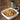 A picture of Pasta Puttanesca made with Olivelle's Olive Tapenade pictured in the background.