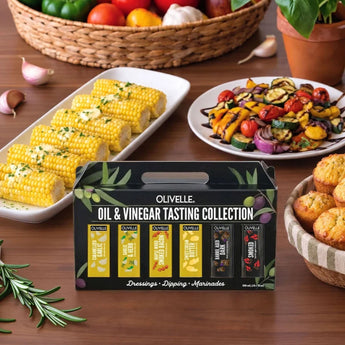 Olivelle Savory Oil and Vinegar Tasting Gift Set with six 50 ml bottles in a gift box surrounded by different meals.