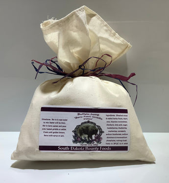 South Dakota Bounty Foods Buffalo Jump Griddle Cakes Mix in a muslin bake with ribbon.