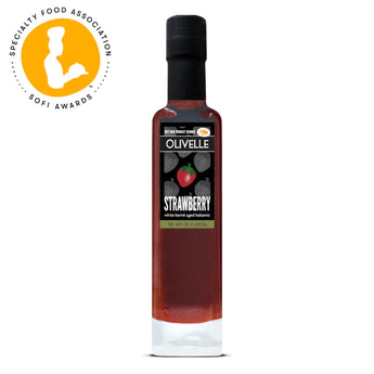Bottle of Strawberry White Barrel Aged Balsamic with rubber pour spout - a sweet and tangy infused vinegar perfect for salads, glazes, and desserts