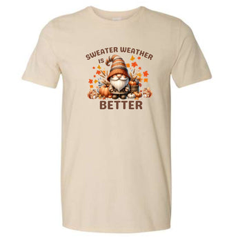 Beige t-shirt with a gnome graphic and 'Sweater Weather is Better' text on a white background