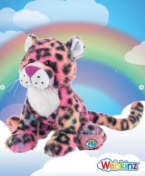 A colorful Webkinz plush leopard toy with pink, purple, and black spots, sitting on white clouds against a rainbow background. The Webkinz logo is visible in the bottom right corner.