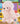 Ganz Webkinz Pink Poodle plush with pale pink fur, fluffy topknot, curly accents, pom-pom tail, and sparkly pink paw pads.