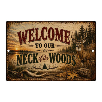 A rustic rectangular metal sign with a western forest scene, featuring a deer, trees, sunset, and the text 'WELCOME TO OUR NECK of the WOODS' on a light gray background.