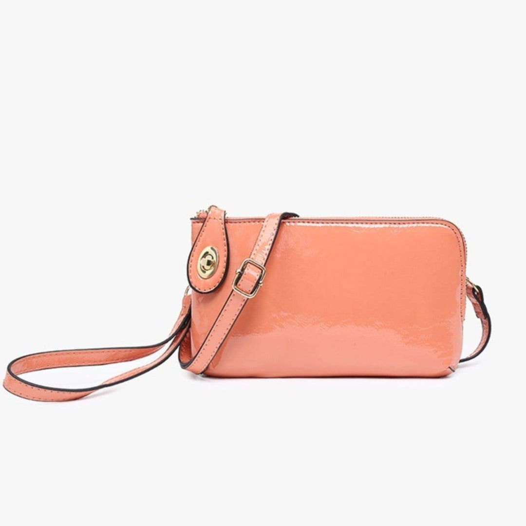 Chivilla Bay's Coral Wristlet that can convert into a crossbody purse with included additional stap.