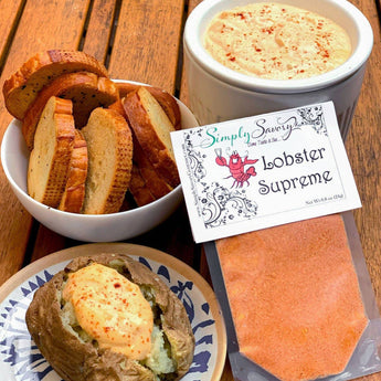 Lobster Supreme food product with bread and dip on a wooden table, featuring 'Simply Savory' branding.