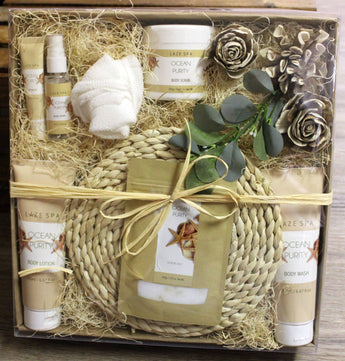 Ocean Purity Spa Gift set with spa products including body lotion, bath towel, and bath bombs in a decorative box.
