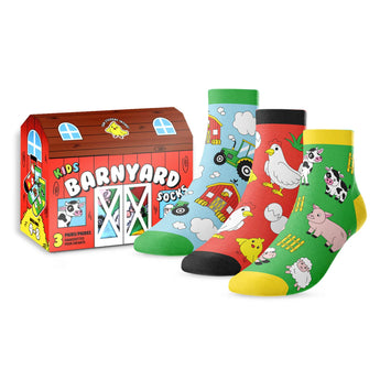 Set of children's barnyard-themed socks with a matching box on a white background