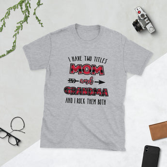 Sport grey unisex graphic t-shirt featuring the phrase “I Have Two Titles Mom and Grandma and I Rock Them Both.”