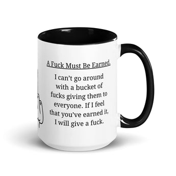Funny 15 oz ceramic coffee mug with black handle and interior featuring the text "A F* Must Be Earned".