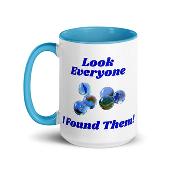15 oz blue handle mug with ‘Look Everyone, I found them’ and marbles graphic