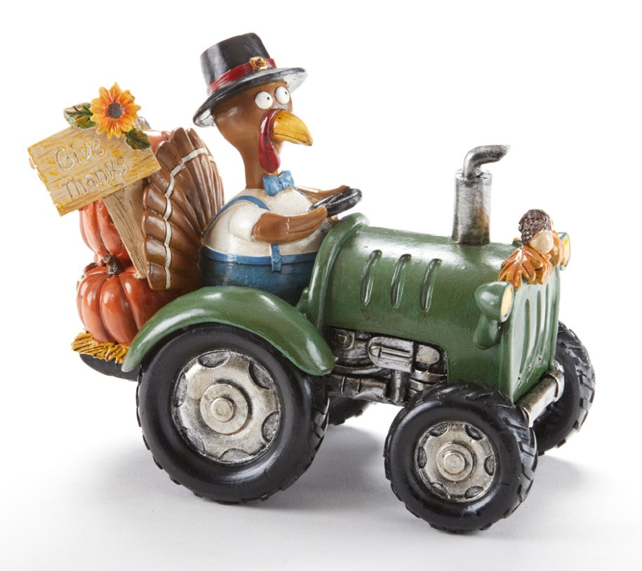 Thanksgiving Turkey on Tractor with give thanks sign delivering pumpkins