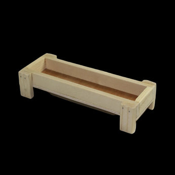 Handmade wooden toy farm feed bunk made from natural unfinished wood