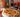 Rustic Heirloom Tomato Galette made with Tuscan Herb Olive Oil, Sun Dried Tomato Balsamic, and Black Garlic Infused Sea Salt.