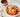 Trofie pasta coated in creamy tomato vodka sauce and topped with grated Parmesan cheese and fresh parsley.