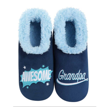 A selection of Men's Slippers from Chivilla Bay, featuring super soft plaid patterns and embroidered designs with funny and heartfelt sentiments for dad and grandpa, set in a cozy ambiance.