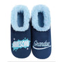 A selection of Men's Slippers from Chivilla Bay, featuring super soft plaid patterns and embroidered designs with funny and heartfelt sentiments for dad and grandpa, set in a cozy ambiance.