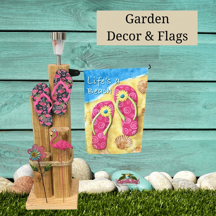 A garden solar light post featuring a flip flop theme and flip flop garden flag. Helpling to create a magical outdoor space for relaxation and fun.