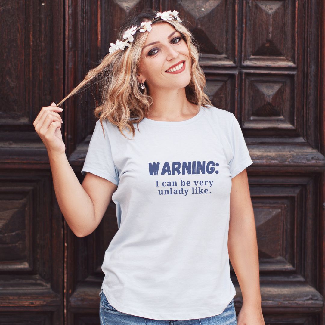 Gildan unisex cotton t-shirt in classic boxy style, emblazoned with 'Warning: I can be a bit unladylike' message, sizes Small to 3XL.